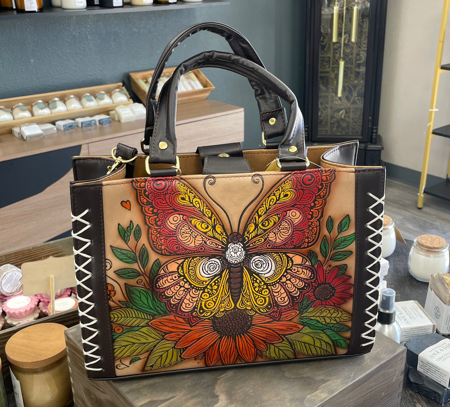 Decorative bag with floral design on a gray surface